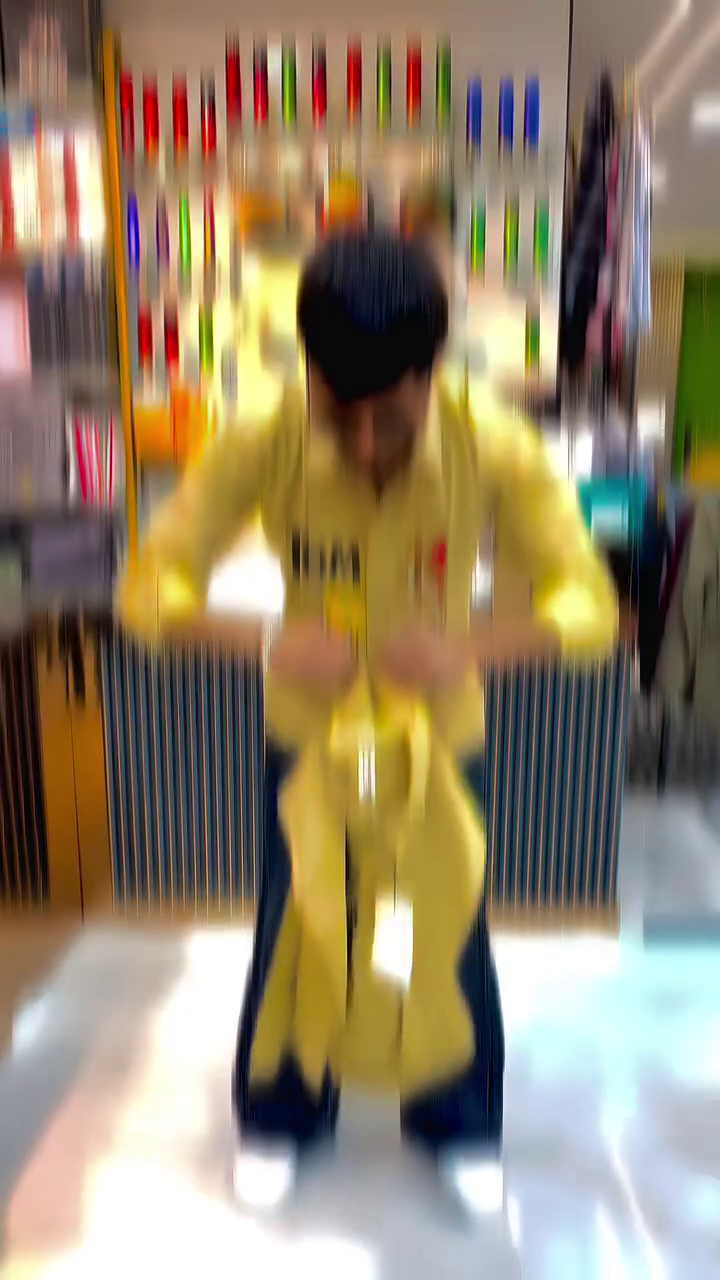 Trendy Yellow Graphic Shirt Featuring Iconic Cartoon Print Design