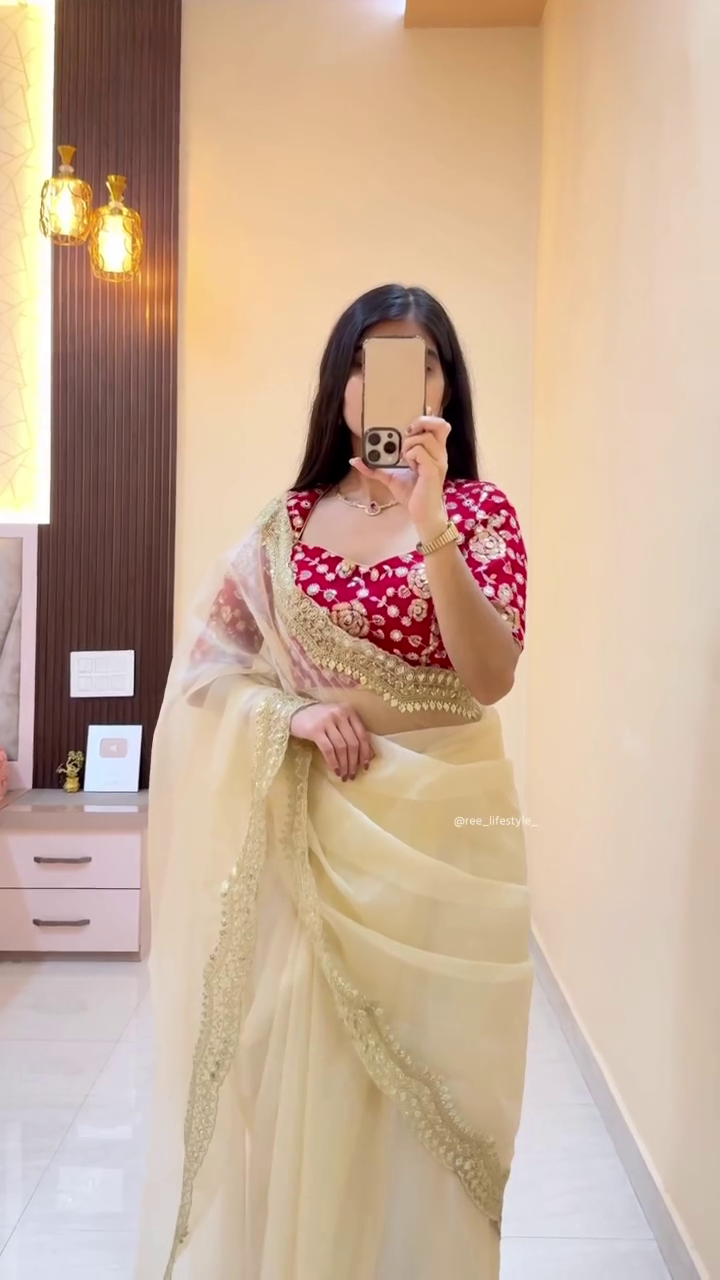 Elegant Cream Saree with Gold Border and Red Floral Blouse