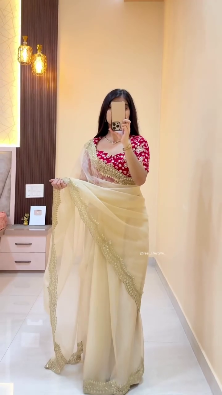 Elegant Cream Saree with Gold Border and Red Floral Blouse